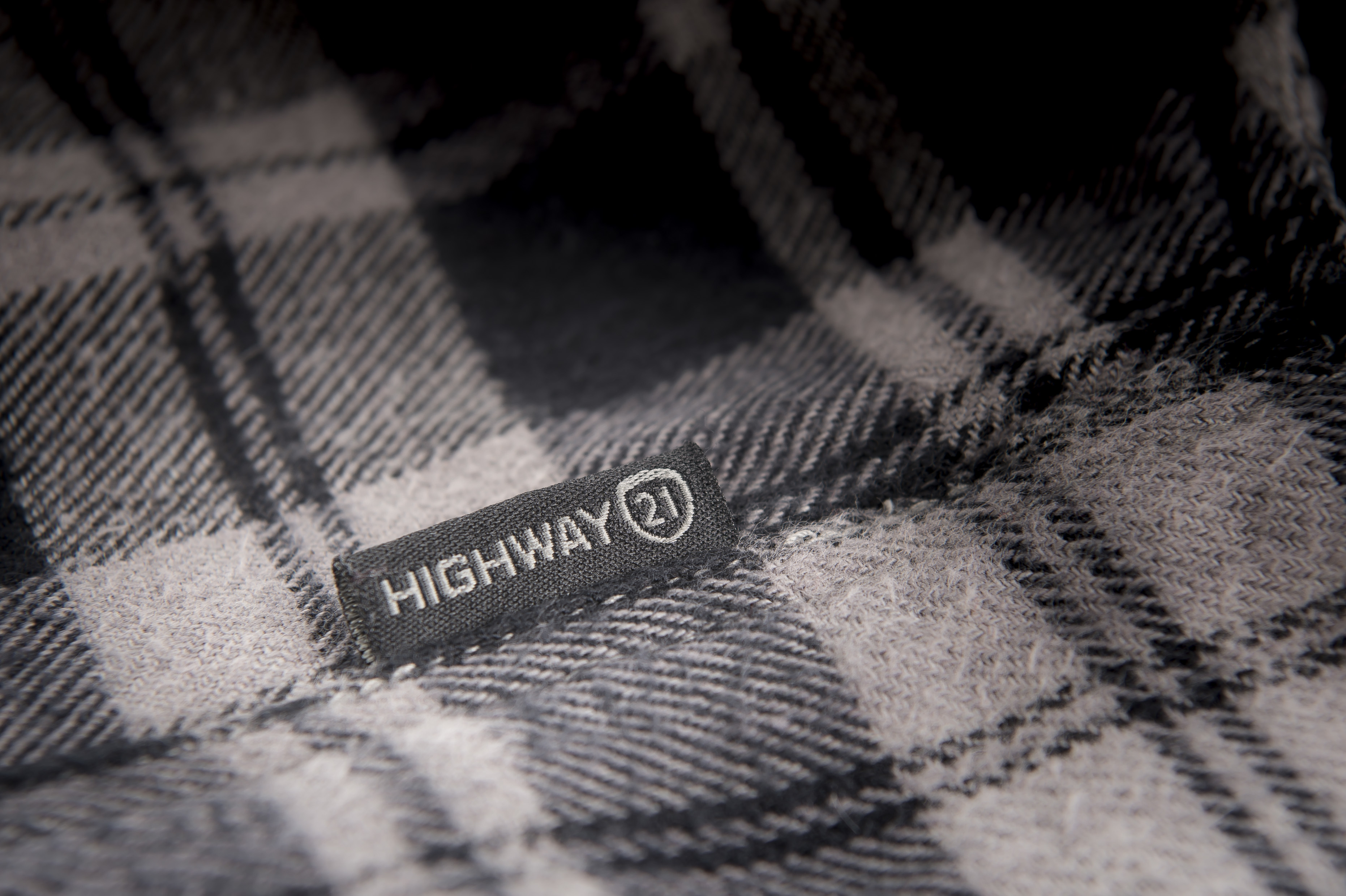 Highway 21 label on the black and grey Marksman Flannel