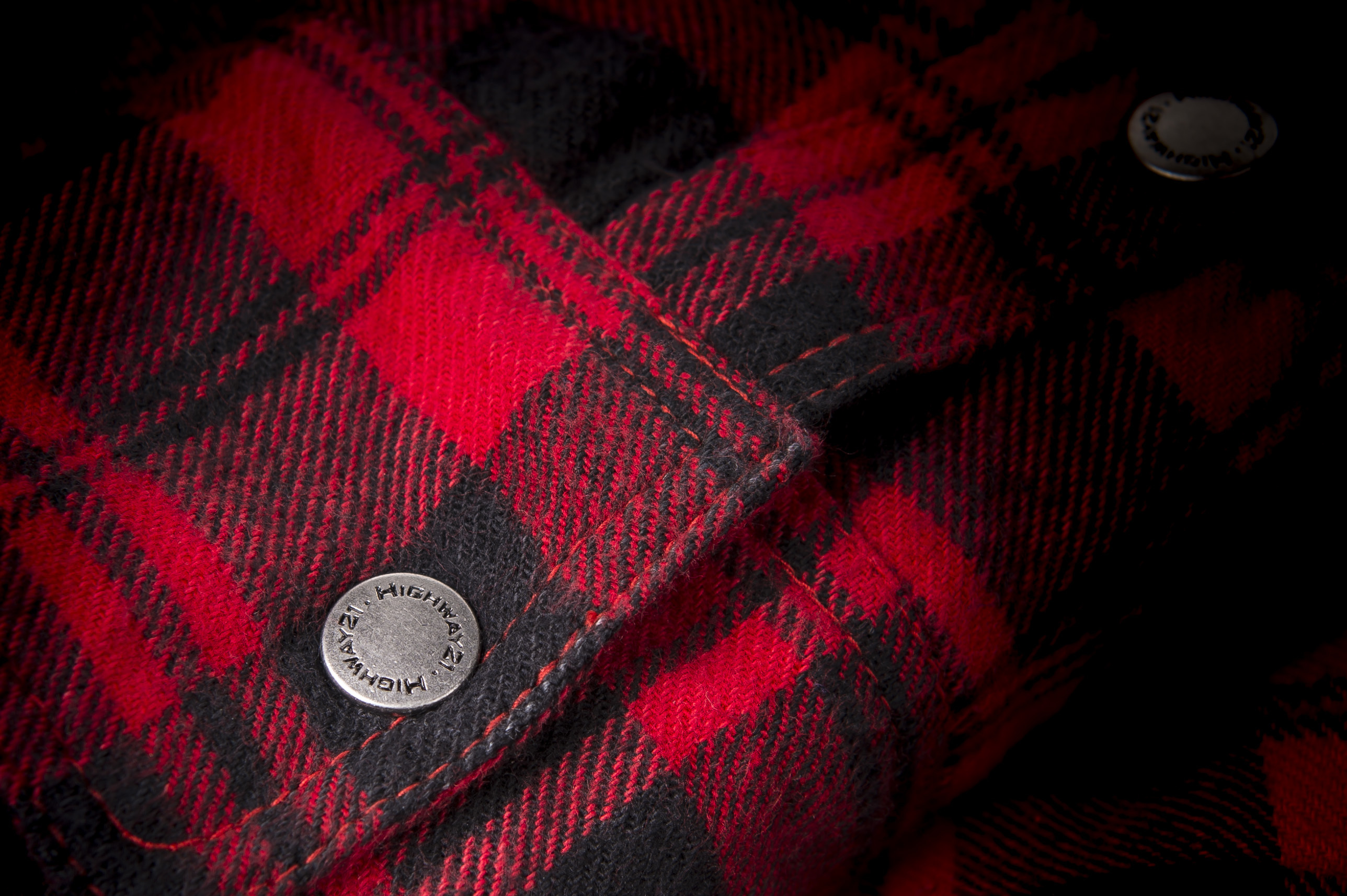 Detail shot of the pattern on the Marksman Flannel in red and black