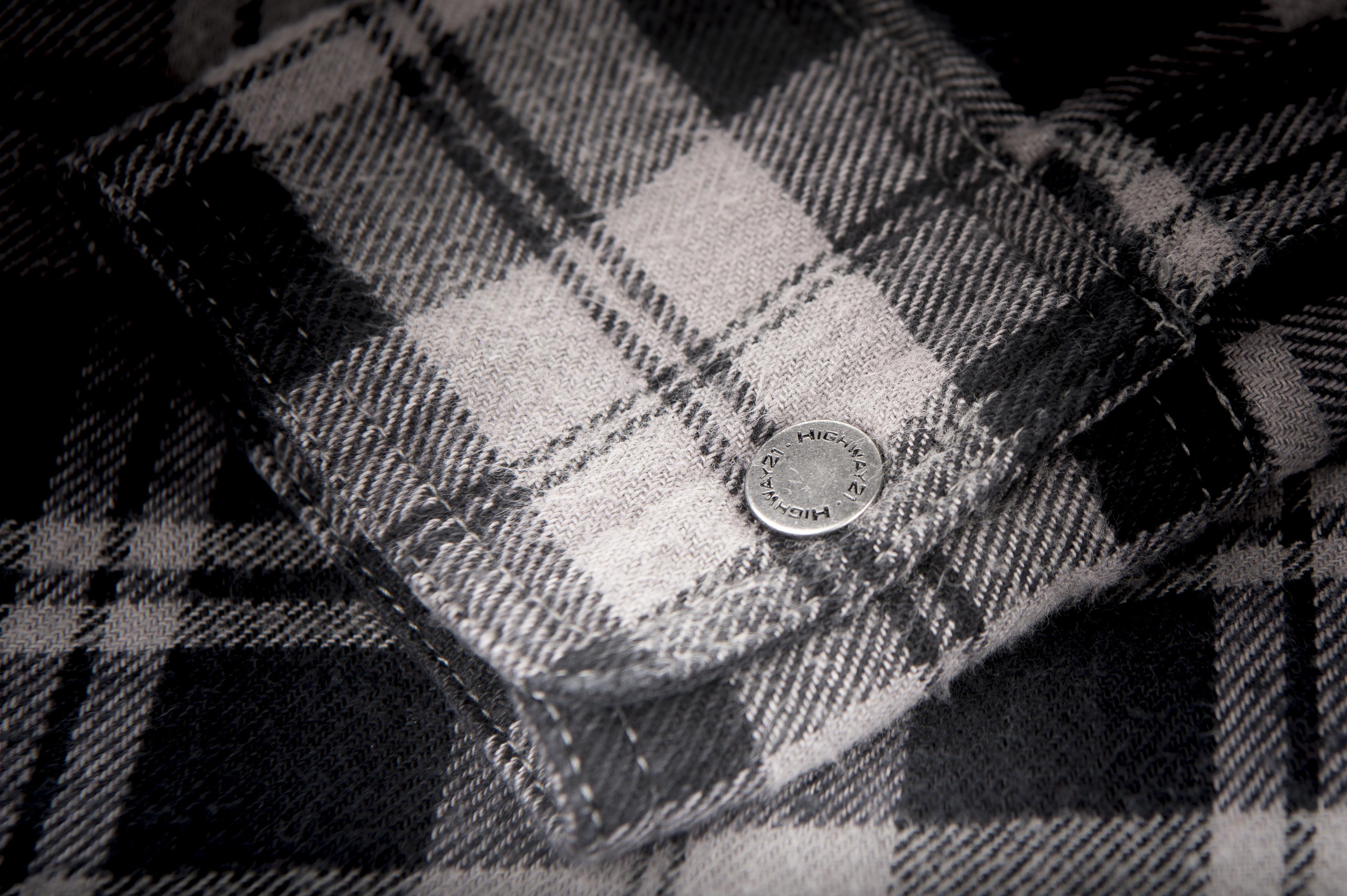 Cuff button on the grey and black Marksman Flannel