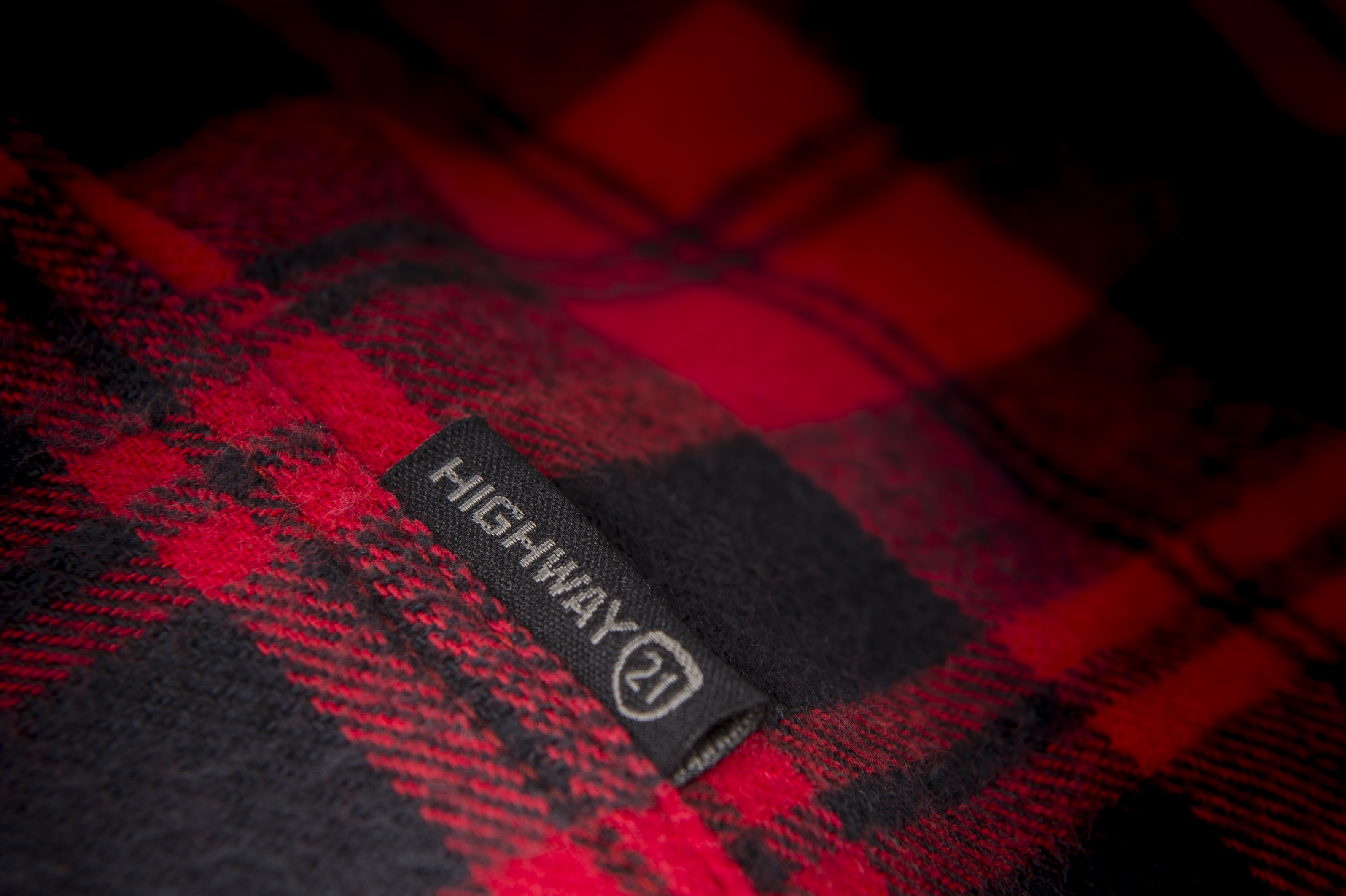 Highway 21 tag on the Marksman Flannel in red and black